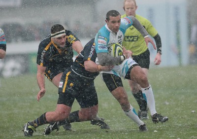 04.02.12 Worcester v Ospreys - LV=Cup -.Ospreys' Eli Walker is tackled by Worcester's George Porter.