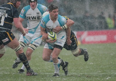 04.02.12 Worcester v Ospreys - LV=Cup -.Ospreys' Rhys Webb is tackled by Worcester's Blair Cowan .