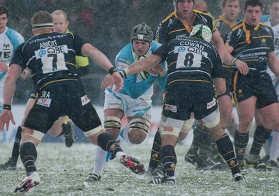 04.02.12 Worcester v Ospreys - LV=Cup -.Ospreys' Tom Smith is tackled by Worcester's Blair Cowen.