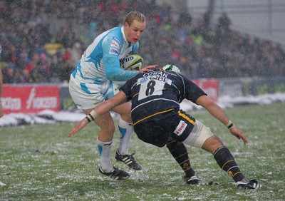 04.02.12 Worcester v Ospreys - LV=Cup -.Ospreys' Hanno Dirkson is tackled by Worcester's Blair Cowan .