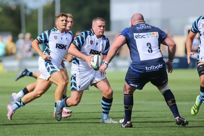 050926 - Worcester Warriors v Cardiff Rugby - Preseason Friendly - Dan Thomas of Cardiff takes on Fraser Balmain of Worcester Warriors