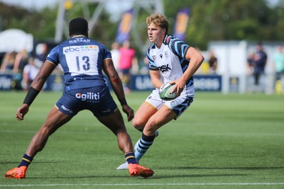050926 - Worcester Warriors v Cardiff Rugby - Preseason Friendly - Jacob Beetham of Cardiff passes under pressure from Siva Naulago of Worcester Warriors