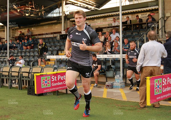 150814 - Worcester Warriors v Ospreys - Preseason friendly - Jonathan Spratt of Ospreys leads his side out