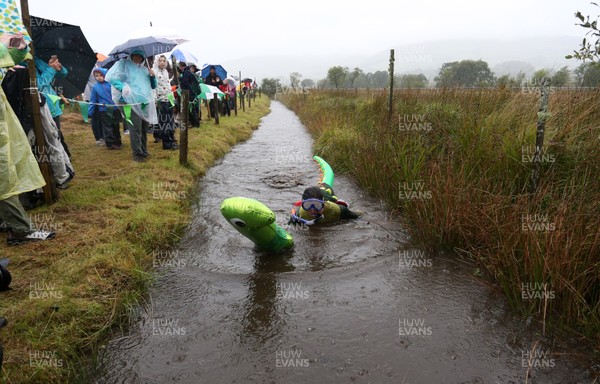 260818 - Picture shows people taking part in the annual World Bog Snorkelling Championships in Llanwrtyd Wells, Powys, Wales