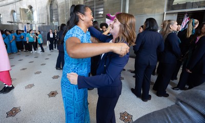 170825 - Women’s Rugby World Cup Welcome Ceremony - Wales’ Kate Williams embraces friends at the Women’s Rugby World Cup welcome ceremony at Manchester Town Hall 