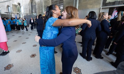 170825 - Women’s Rugby World Cup Welcome Ceremony - Wales’ Kate Williams embraces friends at the Women’s Rugby World Cup welcome ceremony at Manchester Town Hall 