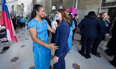 170825 - Women’s Rugby World Cup Welcome Ceremony - Wales’ Kate Williams embraces friends at the Women’s Rugby World Cup welcome ceremony at Manchester Town Hall 