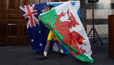 170825 - Women’s Rugby World Cup Welcome Ceremony - A young dancer performs with a Wales flag at the Women’s Rugby World Cup welcome ceremony at Manchester Town Hall 