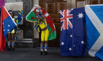 170825 - Women’s Rugby World Cup Welcome Ceremony - A young dancer performs with a Wales flag at the Women’s Rugby World Cup welcome ceremony at Manchester Town Hall 