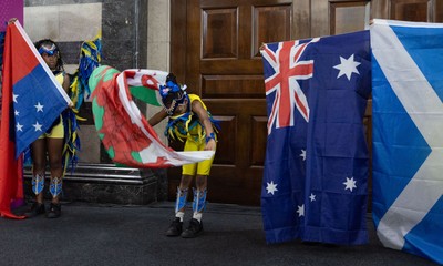 170825 - Women’s Rugby World Cup Welcome Ceremony - A young dancer performs with a Wales flag at the Women’s Rugby World Cup welcome ceremony at Manchester Town Hall 