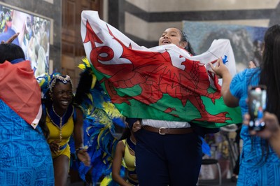 170825 - Women’s Rugby World Cup Welcome Ceremony - Wales’ Sisilia Tuipulotu take the Wales flag and joins in with the welcome dance troop at the Women’s Rugby World Cup welcome ceremony at Manchester Town Hall
