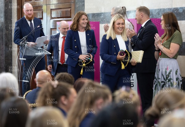170825 - Women’s Rugby World Cup Welcome Ceremony - Wales co-captains Alex Callendar and Kate Williams and Sean Lynn, Wales Women head coach receive their caps and participation medal at the Women’s Rugby World Cup welcome ceremony at Manchester Town Hall