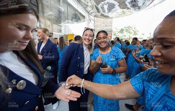 170825 - Women’s Rugby World Cup Welcome Ceremony - Wales’ players exchange gifts with the other teams at the Women’s Rugby World Cup welcome ceremony at Manchester Town Hall 