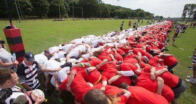 240816 - World Record attempt for the Largest Rugby Scrum - Participants set a new World Record of 1297 in the Worlds Largest Rugby Scrum at the Golden Oldies World Rugby Festival in Cardiff