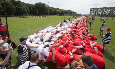 240816 - World Record attempt for the Largest Rugby Scrum - Participants set a new World Record of 1297 in the Worlds Largest Rugby Scrum at the Golden Oldies World Rugby Festival in Cardiff
