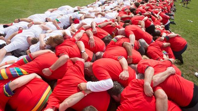 240816 - World Record attempt for the Largest Rugby Scrum - Participants set a new World Record of 1297 in the Worlds Largest Rugby Scrum at the Golden Oldies World Rugby Festival in Cardiff