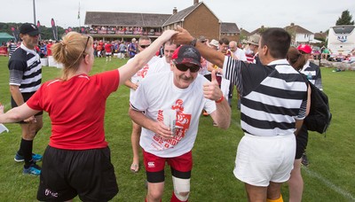 240816 - World Record attempt for the Largest Rugby Scrum - Participants wait to bind together as the attempt for the Worlds Largest Rugby Scrum gets underway at the Golden Oldies World Rugby Festival in Cardiff The new record of 1297 was successful