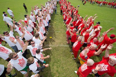 240816 - World Record attempt for the Largest Rugby Scrum - Participants wait to bind together as the attempt for the Worlds Largest Rugby Scrum gets underway at the Golden Oldies World Rugby Festival in Cardiff The new record of 1297 was successful
