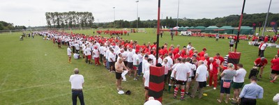 240816 - World Record attempt for the Largest Rugby Scrum - Participants wait to bind together as the attempt for the Worlds Largest Rugby Scrum gets underway at the Golden Oldies World Rugby Festival in Cardiff The new record of 1297 was successful