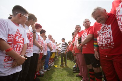240816 - World Record attempt for the Largest Rugby Scrum - Participants wait to bind together as the attempt for the Worlds Largest Rugby Scrum gets underway at the Golden Oldies World Rugby Festival in Cardiff The new record of 1297 was successful