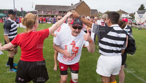 240816 - World Record attempt for the Largest Rugby Scrum - Participants wait to bind together as the attempt for the Worlds Largest Rugby Scrum gets underway at the Golden Oldies World Rugby Festival in Cardiff The new record of 1297 was successful