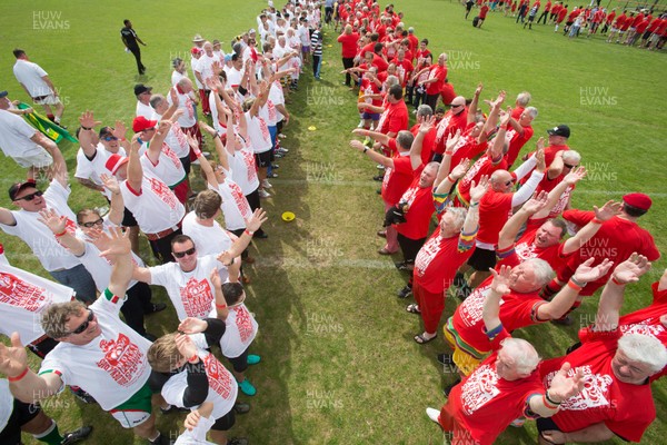 240816 - World Record attempt for the Largest Rugby Scrum - Participants wait to bind together as the attempt for the Worlds Largest Rugby Scrum gets underway at the Golden Oldies World Rugby Festival in Cardiff The new record of 1297 was successful