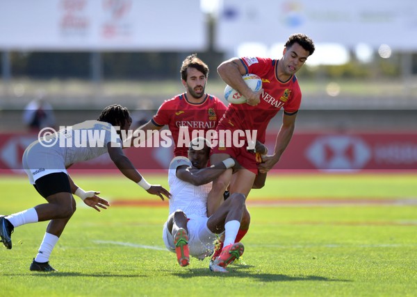 210122 - Spain v USA - HSBC World Rugby Sevens Series -  Spain’s Eduardo Lopez is tackled by Perry Baker as Carlin Isles(lt) comes in to help