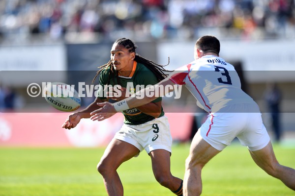 220122 - England v South Africa - HSBC World Rugby Sevens Series -  South Africa’s Justin Geduld is tackled by Alex Davis