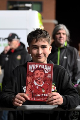 281025 - Wrexham v Cardiff City - Carabao Cup Round 4 - A Wrexham fan with a signed program