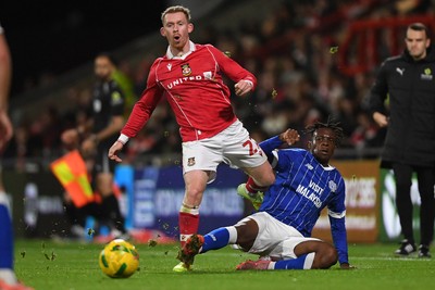 281025 - Wrexham v Cardiff City - Carabao Cup Round 4 - Lewis O'Brien of Wrexham is challenged by Ronan Kpakio of Cardiff City