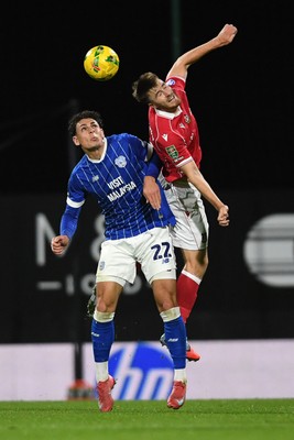 281025 - Wrexham v Cardiff City - Carabao Cup Round 4 - George Thomason of Wrexham is challenged by Yousef Salech of Cardiff City
