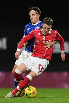 281025 - Wrexham v Cardiff City - Carabao Cup Round 4 - Nathan Broadhead of Wrexham is challenged by Joel Colwill of Cardiff City