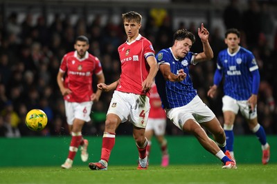 281025 - Wrexham v Cardiff City - Carabao Cup Round 4 - Max Cleworth of Wrexham is challenged by Rubin Colwill of Cardiff City