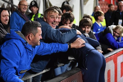281025 - Wrexham v Cardiff City - Carabao Cup Round 4 - Cardiff City fans celebrate the win at full time with Brian Barry-Murphy, Cardiff City Manager
