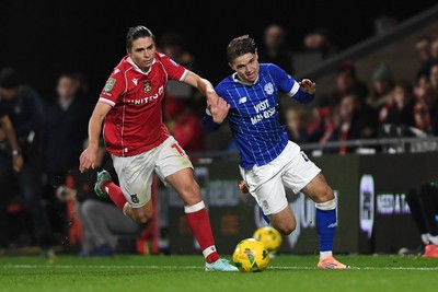 281025 - Wrexham v Cardiff City - Carabao Cup Round 4 - Cian Ashford of Cardiff City is challenged by George Dobson of Wrexham