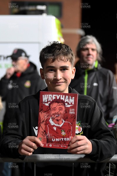 281025 - Wrexham v Cardiff City - Carabao Cup Round 4 - A Wrexham fan with a signed program