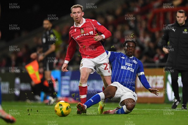 281025 - Wrexham v Cardiff City - Carabao Cup Round 4 - Lewis O'Brien of Wrexham is challenged by Ronan Kpakio of Cardiff City