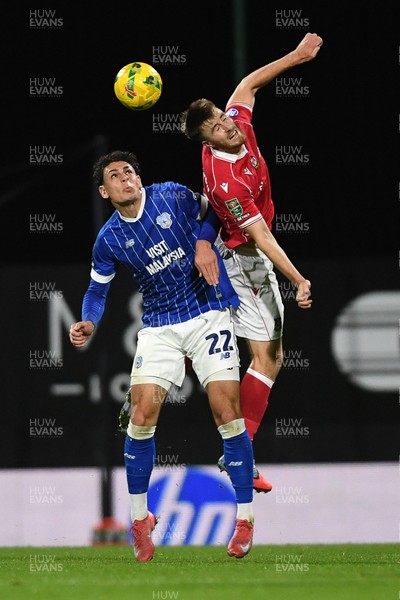 281025 - Wrexham v Cardiff City - Carabao Cup Round 4 - George Thomason of Wrexham is challenged by Yousef Salech of Cardiff City
