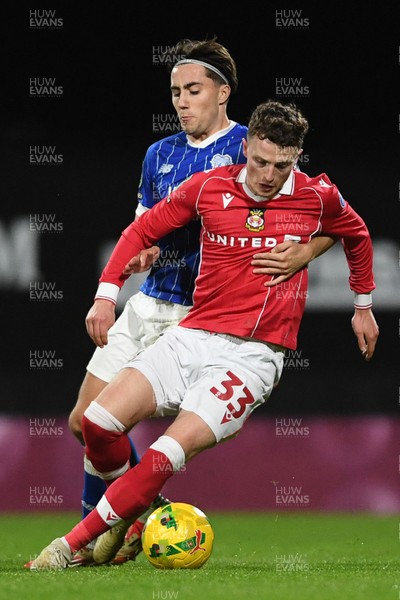281025 - Wrexham v Cardiff City - Carabao Cup Round 4 - Nathan Broadhead of Wrexham is challenged by Joel Colwill of Cardiff City