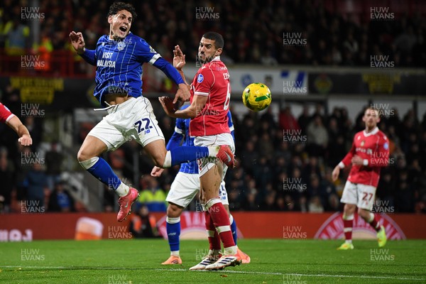 281025 - Wrexham v Cardiff City - Carabao Cup Round 4 - Yousef Salech of Cardiff City is challenged by Conor Coady of Wrexham