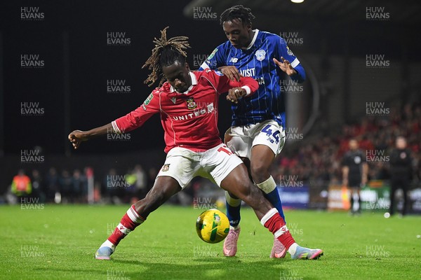 281025 - Wrexham v Cardiff City - Carabao Cup Round 4 - Issa Kabore of Wrexham is challenged by Ronan Kpakio of Cardiff City