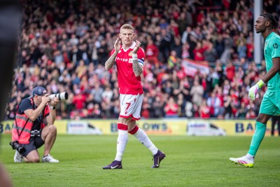 260425 - Wrexham v Charlton Athletic - Sky Bet League 1 -  James McClean of Wrexham AFC leads out his team ahead of kick off