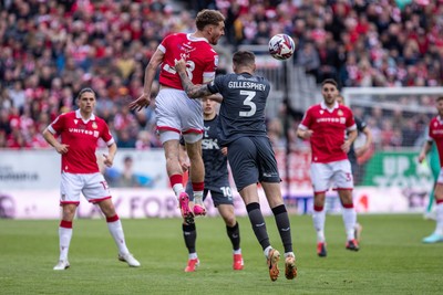 260425 - Wrexham v Charlton Athletic - Sky Bet League 1 - Sam Smith of Wrexham AFC beats Macaulay Gillesphey of Charlton Athletic to a header
