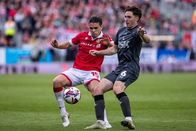 260425 - Wrexham v Charlton Athletic - Sky Bet League 1 - George Dobson of Wrexham AFC challenges Conor Coventry of Charlton Athletic
