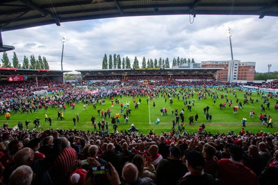 260425 - Wrexham v Charlton Athletic - Sky Bet League 1 - Wrexham fans celebrate at full time following their promotion securing victory over Charlton