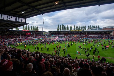 260425 - Wrexham v Charlton Athletic - Sky Bet League 1 - Wrexham fans celebrate at full time following their promotion securing victory over Charlton