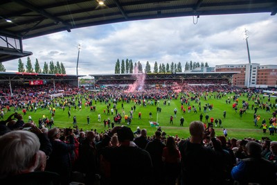 260425 - Wrexham v Charlton Athletic - Sky Bet League 1 - Wrexham fans celebrate at full time following their promotion securing victory over Charlton