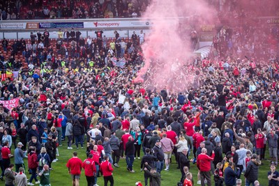 260425 - Wrexham v Charlton Athletic - Sky Bet League 1 - Wrexham fans celebrate following their promotion securing victory over Charlton