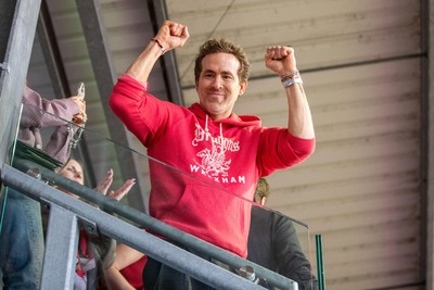 260425 - Wrexham v Charlton Athletic - Sky Bet League 1 - Wrexham co-owner Ryan Reynolds celebrates at full time