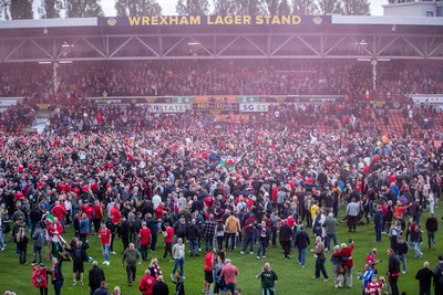 260425 - Wrexham v Charlton Athletic - Sky Bet League 1 - Wrexham fans celebrate promotion at full time